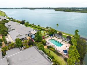 an aerial view of a house with a swimming pool at Harrington River Lodge in Harrington