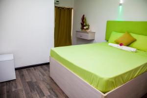 Postel nebo postele na pokoji v ubytování Le Secret de Jasmin