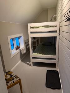 a room with two bunk beds in a attic at Vörderåsgården in Transtrand