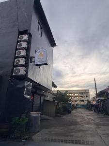 a building with a sign on the side of it at Manatad Transient Deluxe Room 2 in Surigao