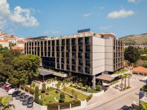 an aerial view of a building with a parking lot at Hotel Sumratin in Dubrovnik