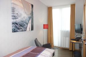 TV a/nebo společenská místnost v ubytování Hotel Gode Wind