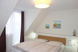 Postel nebo postele na pokoji v ubytování Hotel Gode Wind