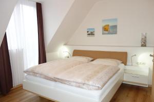 Postel nebo postele na pokoji v ubytování Hotel Gode Wind