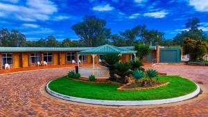 a house with a pavilion in front of it at Nandewar Motor Inn in Narrabri