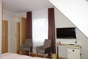TV a/nebo společenská místnost v ubytování Hotel Gode Wind