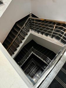 an empty stairwell in a building with metal scaffolding at Hotel The Edge in Rewa