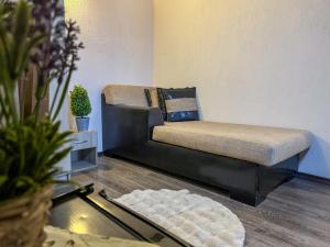 a couch in a living room with a table at СТАР МЕРАК in Ribarica