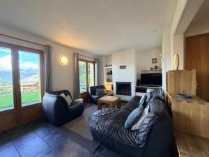 a living room with a couch and two chairs at Mont Bijou MOUNTAIN & QUIET chalet 10 pers by Alpvision Résidences in Veysonnaz