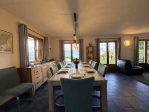 a dining room with a long table and chairs at Mont Bijou MOUNTAIN & QUIET chalet 10 pers by Alpvision Résidences in Veysonnaz