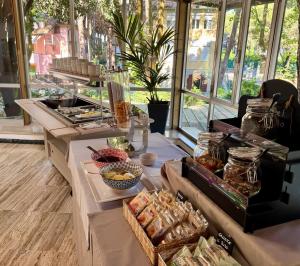 a buffet of food in a room with windows at Hotel Blu Corallo in Marina Romea