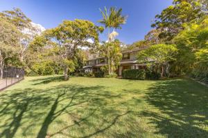an image of a house with a large yard at Sandpiper 21 in Smiths Lake