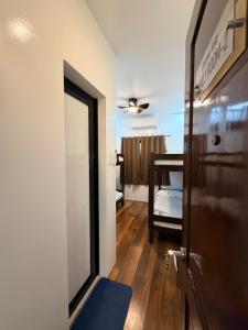 a room with a door and a room with a bathroom at Manatad Transient Family -2 in Surigao