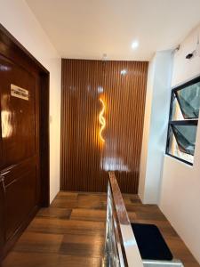 a room with a wooden door and a hallway at Manatad Transient Family -2 in Surigao