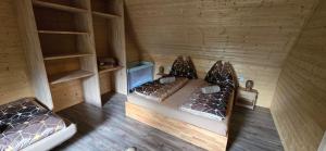 an overhead view of two beds in a room at Farma pod Skalkou in Heľpa +72 photos
