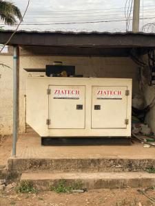 a utility box sitting on the side of a building at PLV Apartment in Ilorin