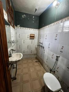 a dirty bathroom with a toilet and a sink at Home stays subash nagar in Jammu