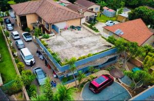 an aerial view of a house with cars parked in a parking lot at Zungu b&b in KwaDukuza +16 photos