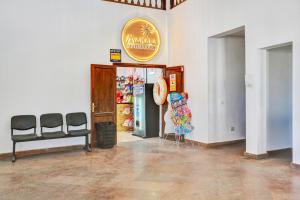 a room with a shop with a sign on the wall at Oasis Duna _ Casa Mate Pool in Corralejo +23 photos