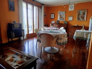 a living room with two tables and a tv at B&B Signora Minù in Perugia