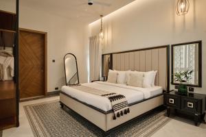a bedroom with a large bed in a room at Villa Raag in Agonda