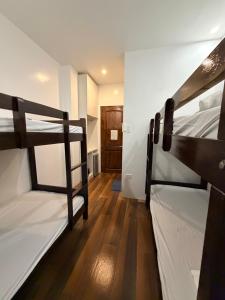 two bunk beds in a room with a hallway at Manatad Transient Family 3 in Surigao
