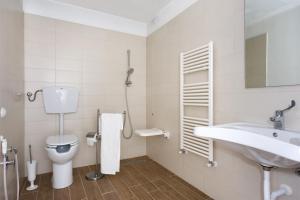 a bathroom with a toilet and a sink at Vele Storiche Pisane - free private parking in Pisa +40 photos