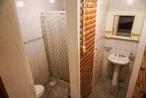 a bathroom with a shower and a toilet and a sink at La Casa de Doña Adela in Eugenio Bustos +16 photos