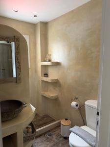 a bathroom with a sink and a toilet at Akrotiri B&B in Porto Kagio +36 photos