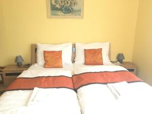 Letto o letti in una camera di Pension VIDHOUS 1