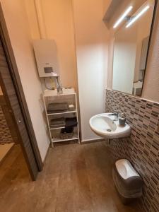 a small bathroom with a sink and a mirror at Alla botte degli Orsini in Attigliano