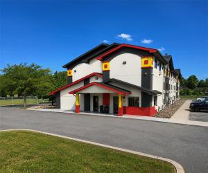 a building on the side of a street at Super 8 by Wyndham Lexington Park/California Area in California