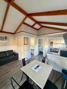 a kitchen and living room with a table and chairs at Holbrook Motor Village in Holbrook