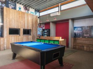 a billiard room with a pool table in it at Vakantiepark 't Strandheem in Opende