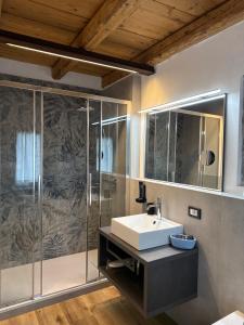 a bathroom with a sink and a shower at B&B Casa Anì in Pordenone +18 photos