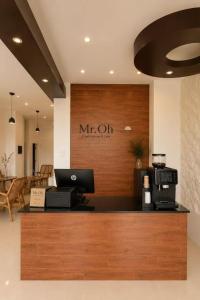 a mr ott counter with a laptop on it at Mr Oh in Phuket Karon in Ka Rorn