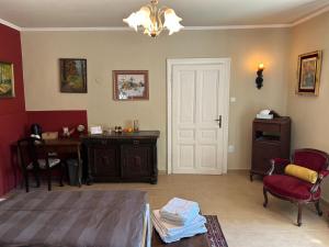 a living room with a table and a white door at Weinvilla in Wolkersdorf