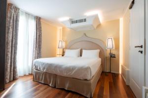 Llit o llits en una habitació de Albergo San Marco 26 fotos més