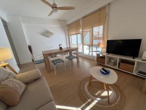 a living room with a couch and a table at 3 Bed Flat - Sleeps 5 - Wifi in Bellreguart