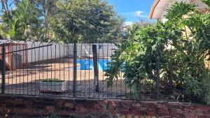 a fence in front of a swimming pool at Rams Blissful Guest House in Rustenburg