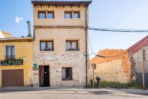 a building on the side of a street at Casa Valle del Lozoya in Rascafría