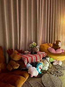 a group of stuffed animals sitting around a table at AN BÌNH Home in Hai Phong +2 photos