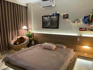 a bedroom with a bed with a pillow on it at AN BÌNH Home in Hai Phong