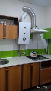 a kitchen with a sink and a counter top at Letto UTZ in Mykolaiv