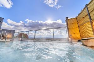 a swimming pool on a building with water in it at Ooedo Onsen Monogatari Dogo in Matsuyama +48 photos
