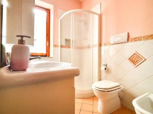 a bathroom with a sink and a toilet and a mirror at Bed and Breakfast Nefer in Maratea +39 photos