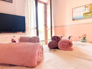 a bedroom with a teddy bear laying on a bed at Bed and Breakfast Nefer in Maratea