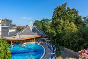 an aerial view of a resort with a swimming pool at Ensana Thermal Hévíz in Hévíz