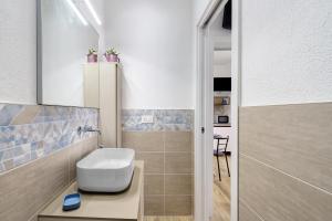 a bathroom with a white toilet and a sink at Il Timone e L'Ulivo in Moneglia +54 photos