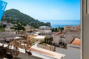 a view of a city from a window at Casa Leucosia Suites in Capri